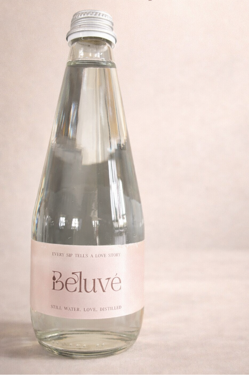 Beluvé hero water bottle with a blush background.